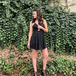 Black dress with middle cut out, back tie and buttons